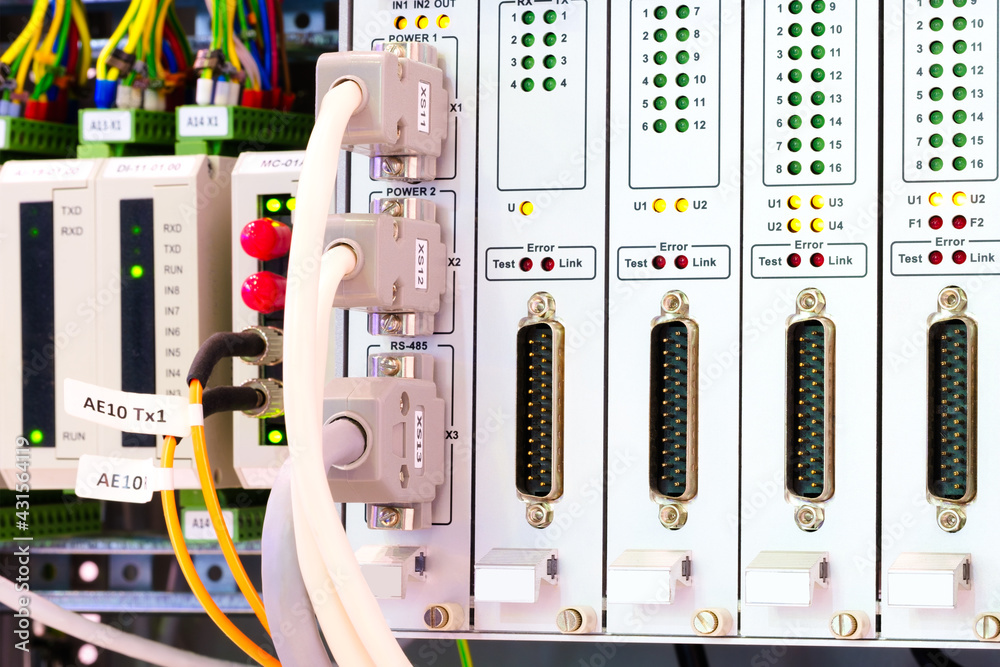 Poster View of communication port module on PLC unit in control box of automation machine