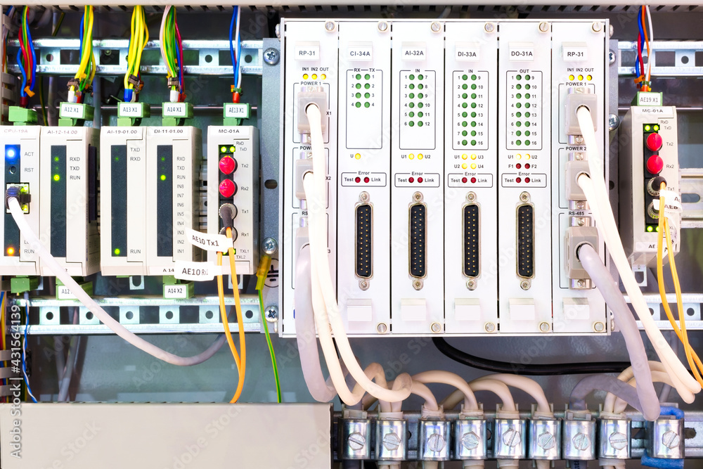 Poster View of communication port module on PLC unit in control box of automation machine