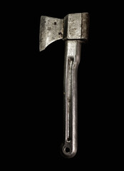 Old silver ax with a metal handle. Isolated on black background