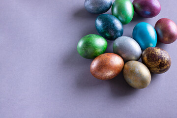Colorful Easter eggs. Easter background. Minimalistic Easter concept on gray background. Card with copy space for text.