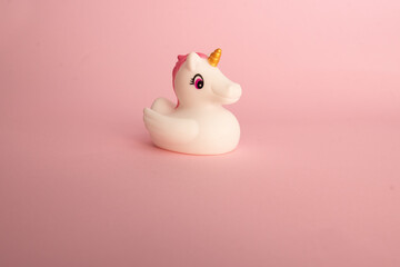 white unicorn on pink background plastic
