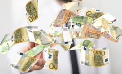 Obraz na płótnie Canvas bill euro banknote in hand rain
