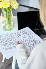 Woman designer create website design wireframe. Sketch, prototype, framework, layout future design...