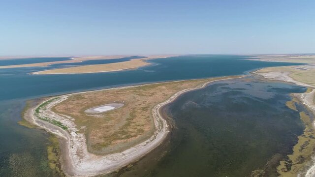 Flight over an islet in a shallow lake