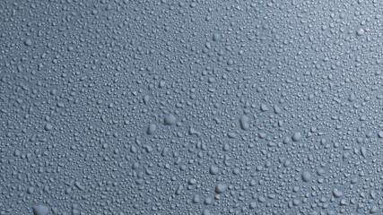 Water drops on a gray surface, a beautiful pattern of water splashes on the background
