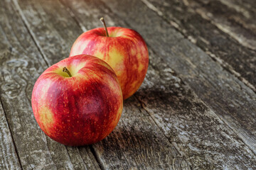 Green and red apples on blackboard or chalkboard background. Bright fruit composition.Red and green apple on old wooden table. Top view with space for your text