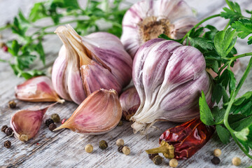 Closeup of Garlic bulbs on wooden table with garlics blur background.