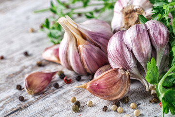 Closeup of Garlic bulbs on wooden table with garlics blur background.