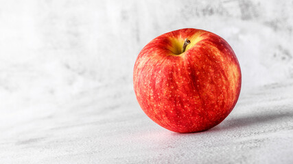  red apples on blackboard or chalkboard background. Bright fruit composition. Close-up on a gray background.