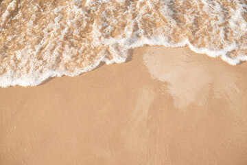 foamy sea water on the beach, golden sand, , sun