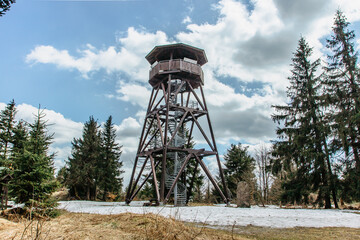 Wooden observation tower called Anna on Anensky Peak in Orlicke Mountains,Czech Republic.Spiral staircase of lookout tower, construction with metal steps and oak platform.Czech tourist place