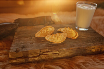 traditional mountain sheep's cheeses on a wooden board