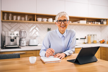 Portrait of a smiling senior businesswoman at home. Working from home.