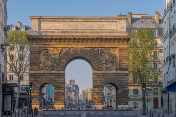 Paris, France - 05 02 2021: View of triumphal arch of Saint-Martin gate from Faubourg Saint-Honore street