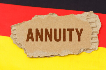 Against the background of the German flag lies cardboard with the inscription - ANNUITY