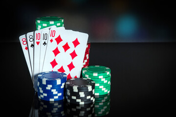 Obraz premium Poker cards with full house or full boat combination. Close-up of playing cards and chips in poker club. Free advertising space