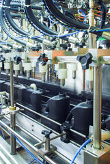 Oil is dispensed into quart bottles