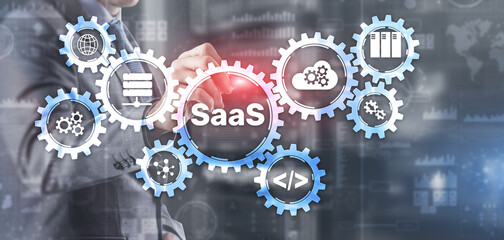 SaaS Software as a Service concept with hand pressing text