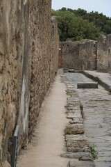 Fototapeta na wymiar Street in ancient city of Pompeii, Italy