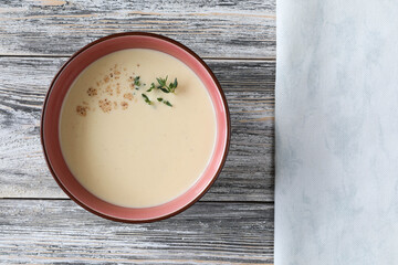 Traditional Italian soup of chicken soup, egg yolks, and wine with copy space - top view