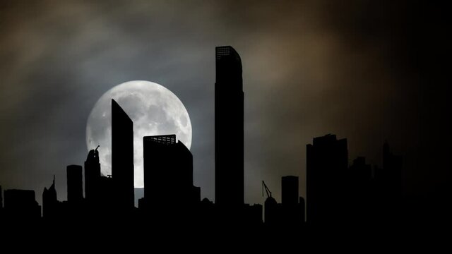 Abu Dhabi Skyline By Night: Time Lapse with Full Moon, United Arab Emirates