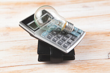 calculator, wallet and lamp