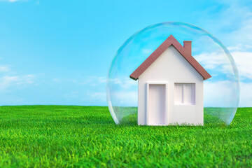 House inside glass transparent dome on green lawn with copy space. Home safety concept. 3D illustration © Yingko