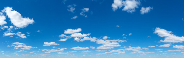 Naklejka na ściany i meble Panoramic fluffy cloud in the blue sky. Sky with cloud on a sunny day.