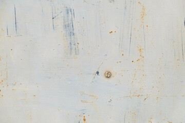 Paint and spray stains on scratched metal texture. Abstract background.