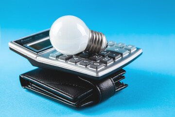 calculator, wallet and lamp