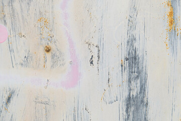 Paint and spray stains on scratched metal texture. Abstract background.