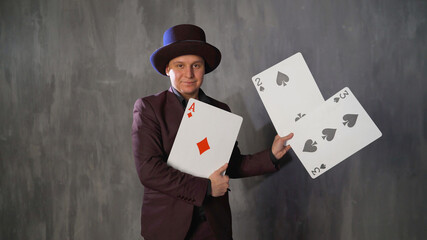 Magician With Playing Cards And Hat. Magician with playing cards.