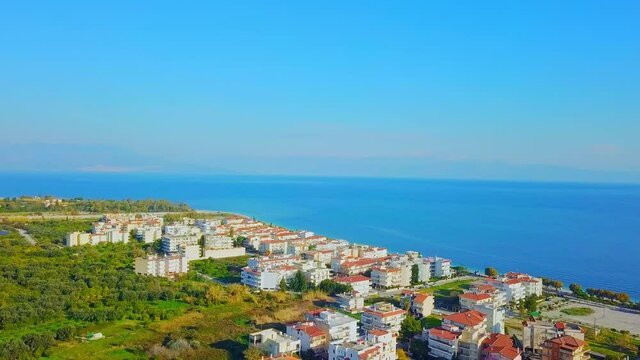 Rotating aerial shot of Diakopto in Greece and the nearby vast sea