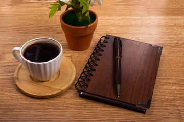 coffee,calculator and notebook on wooden background