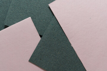 overlapping dusty pink and grey textured paper 