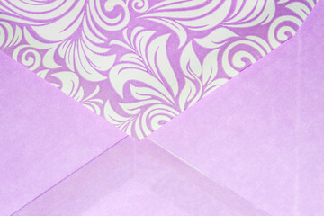closed lavender-coloured envelope flap with white floral or foliage patterns