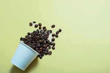  coffee beans in a white paper cup on a beige background. mockup