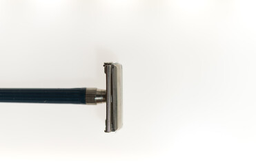 shaving theme - old, used double edged safety razor and blade