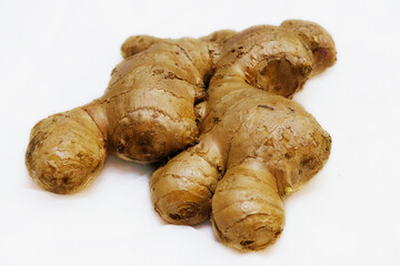 fresh ginger root isolated on a white background in close up