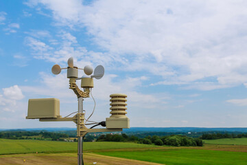 anemometer, wind speed measurement, small weather station. Anemometer on blue sky.