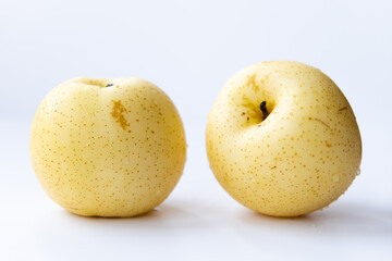 Two Korean pears isolated with a white background