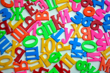 Fototapeta premium multicolored letters of the Russian alphabet on a white background, learning to read and write at home