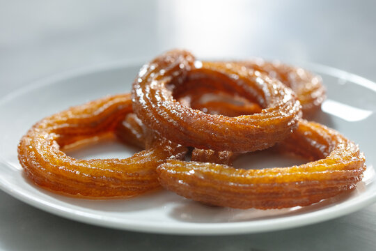 Traditional Turkish ring sweet dessert Halka Tatli. Fried circle desserts. Arabic Ramadan Kareem sweet desserts on table. 