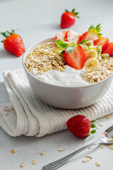 Healthy breakfast. Slimming and keeping fit. Healthy porridge with kiwi, banana and strawberries.