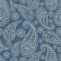Jeans seamless pattern with Indian paisley ornament. Turkish cucumber on blue Denim texture background.