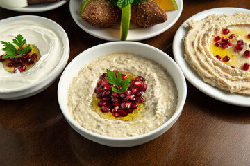 Traditional Middle Eastern food. Lebanese food. Arabian Baba Ghanoush with Pomegranate seeds, Labneh yorgut, Hummus.