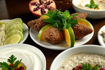 Traditional Middle Eastern food. Lebanese food. Arabian kibbeh with orange, lemon, pomegranate