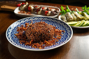Traditional Middle Eastern food. Lebanese food. Arabian lamb barbecue, Mujadara rice and cabbage...