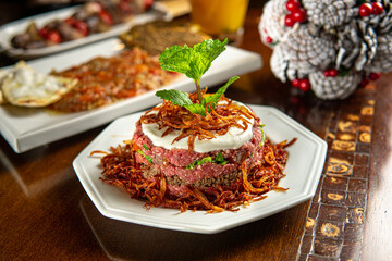 Traditional Middle Eastern food. Lebanese food. Arabian raw lamb meat plate. Christmas decoration