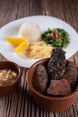 Done Dish - Feijoada complete with rice, cabbage with bacon, farofa and orange